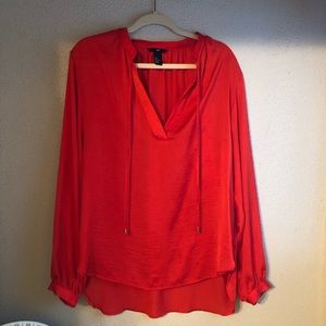 Long sleeved flowy top with sheen